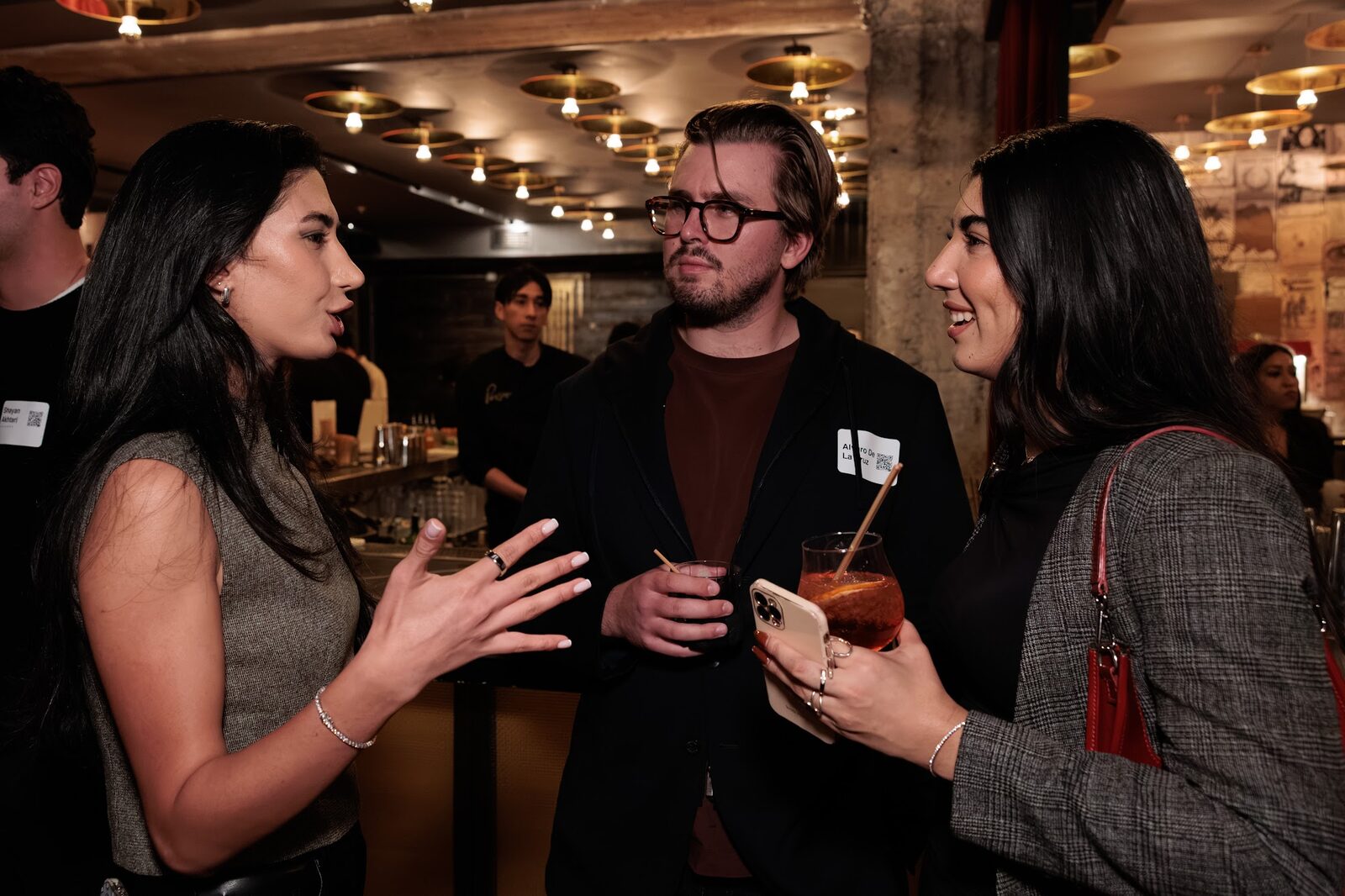 A small group talking over drinks