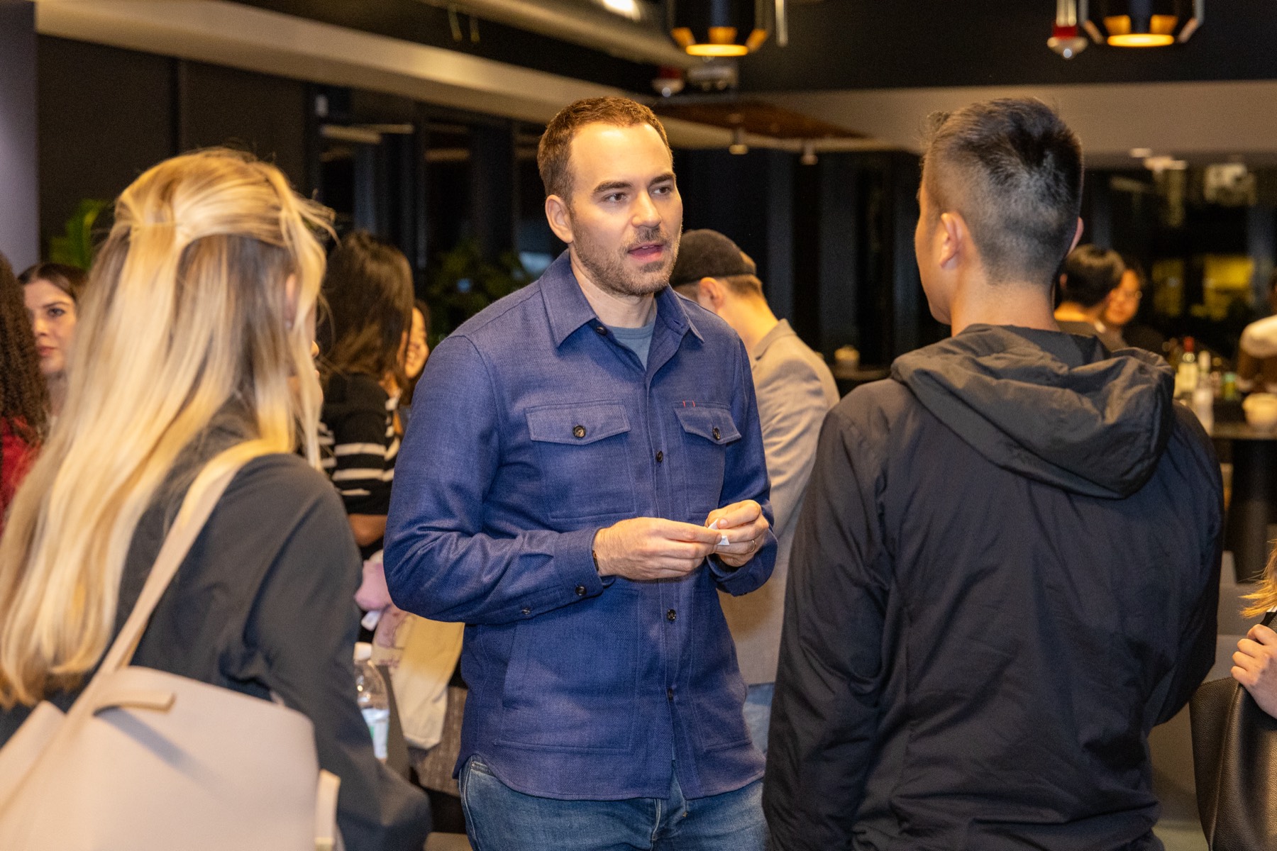 Max Mullen networking with attendees